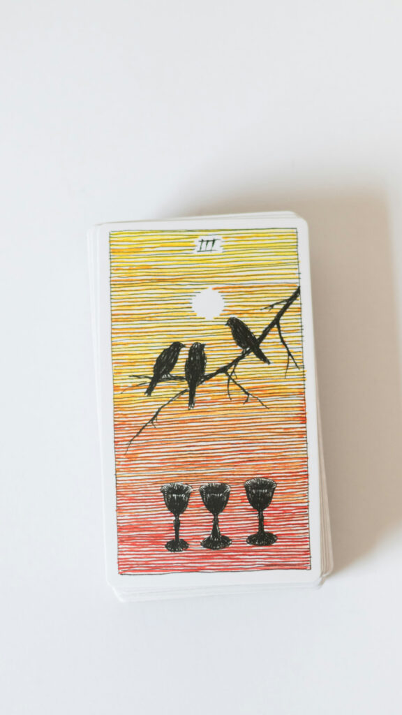 Three of Cups Tarot Card Meaning and Spiritual Connection Wallpaper