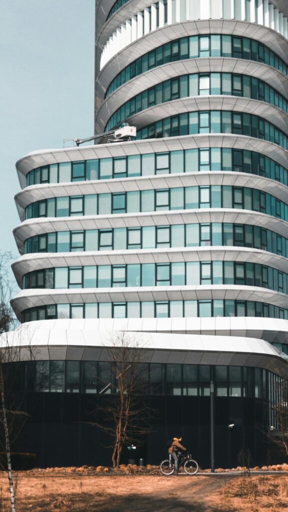 Modern Corporate Skyscraper with Cyclist Mobile Wallpaper