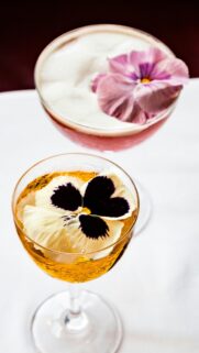 Elegant Cocktails with Pansy Flower Garnishes Mobile Wallpaper