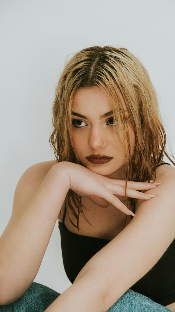 Stunning Blonde Model with Wet Look Hair Portrait Mobile Wallpaper