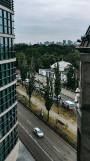 Modern Urban Cityscape with Domed Building and Street View Wallpaper