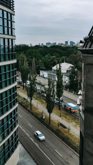 Modern Urban Cityscape with Domed Building and Street View Wallpaper
