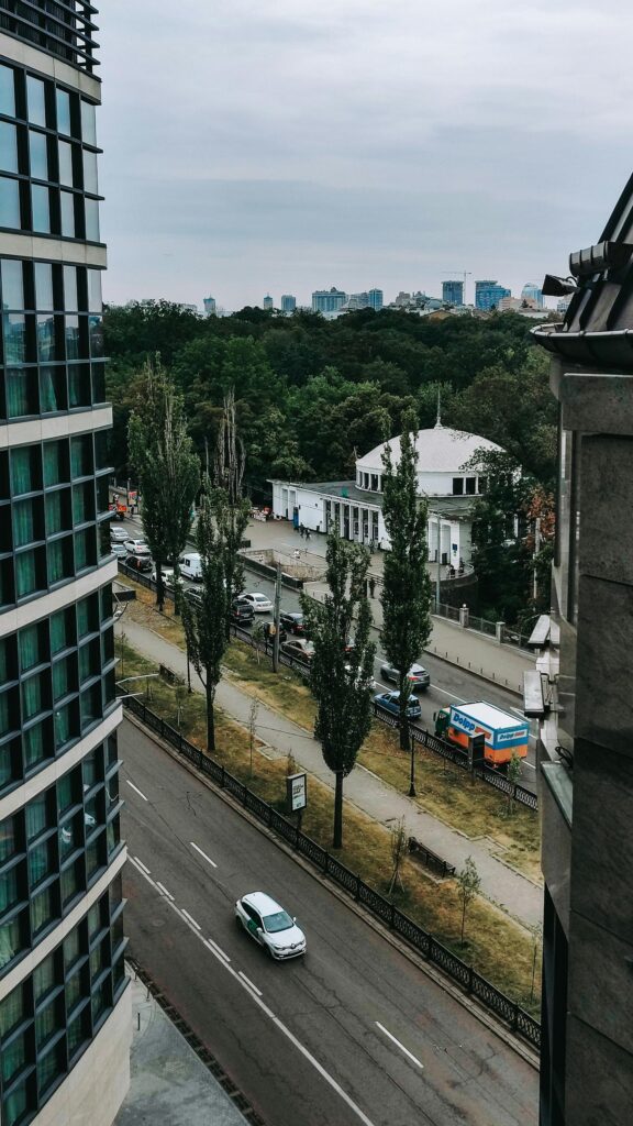 Modern Urban Cityscape with Domed Building and Street View Wallpaper
