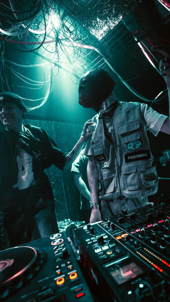 Neon DJ Performance with Fish Mask at Rave Night Wallpaper