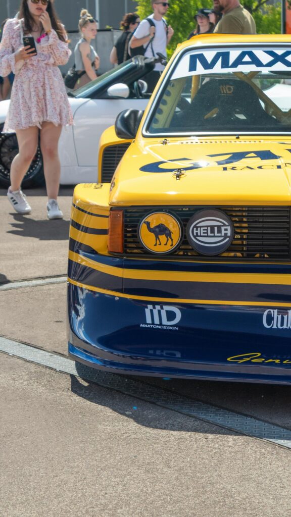Yellow and Blue Racing Car Front Close-up Mobile Wallpaper