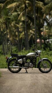 Classic Royal Enfield Motorcycle Silver Bike Tropical Palm Trees Wallpaper