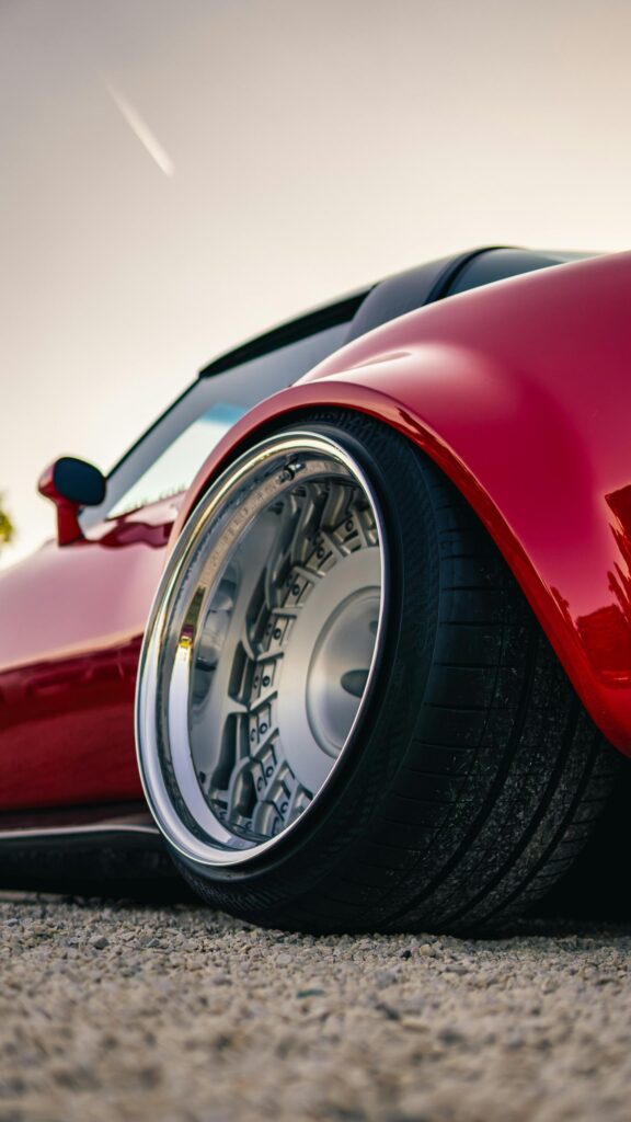 Low Stance Red Sports Car Deep Dish Rim Close Up Mobile Wallpaper