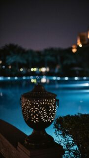Ornate Lantern by a Glowing Pool at Night High Quality Mobile Wallpaper