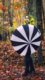 Joker Inspired Cosplay with Umbrella in Autumn Forest Wallpaper