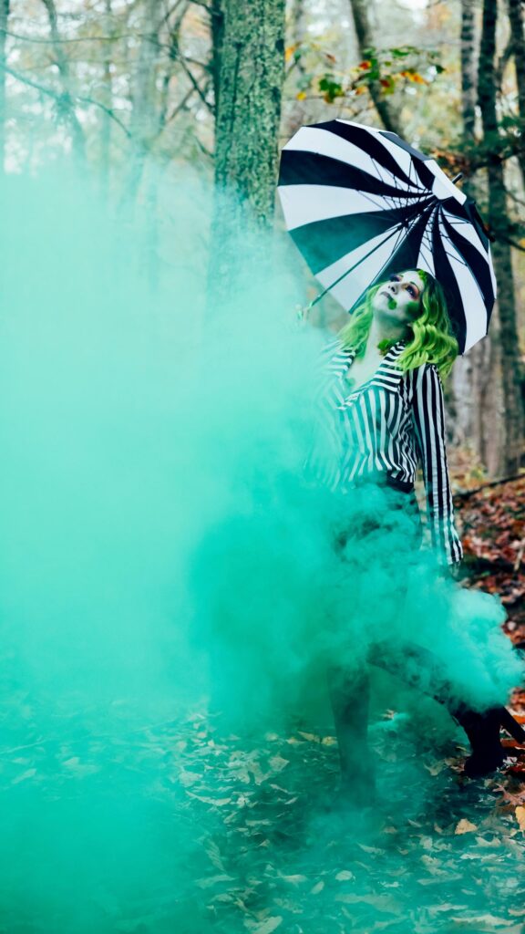 Stunning Beetlejuice Inspired Cosplay Girl with Green Smoke Wallpaper
