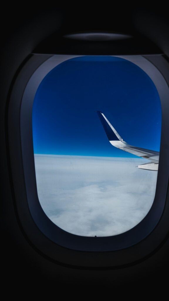 Stunning Plane Wing Above Clouds Travel Aesthetic 4K Wallpaper