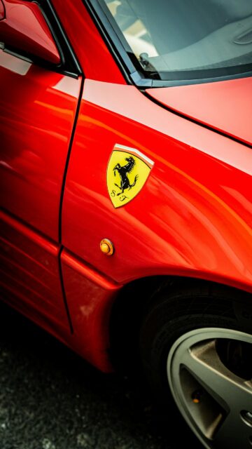 Stunning Ferrari Prancing Horse Emblem Red Sports Car Mobile Wallpaper