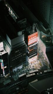 Aerial View of Vibrant Tokyo City Street at Night Phone Wallpaper