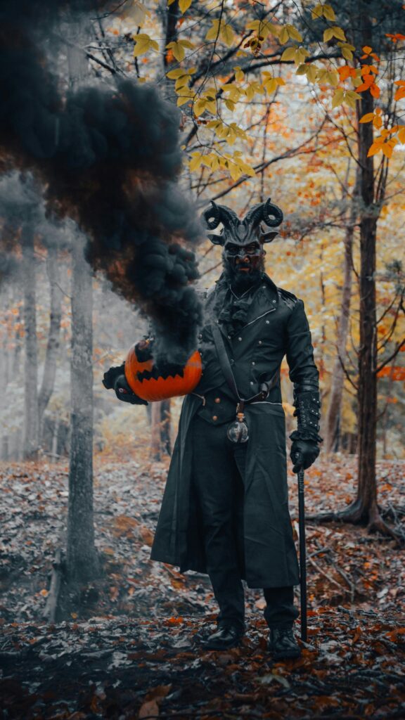 Dark Horned Demon with Smoking Pumpkin Halloween Phone Wallpaper
