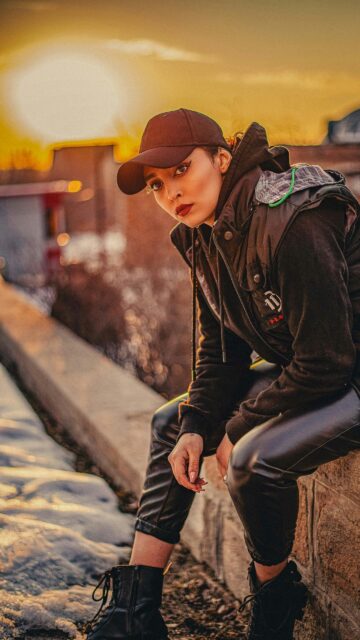 Stunning Fashionable Woman in Sunset Streetwear Phone Wallpaper