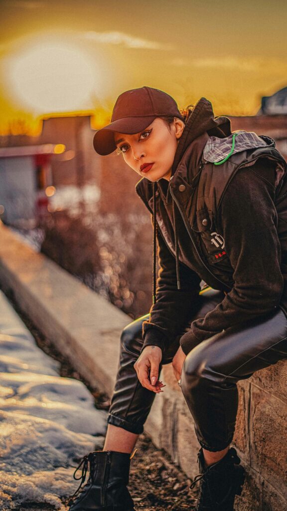 Stunning Fashionable Woman in Sunset Streetwear Phone Wallpaper