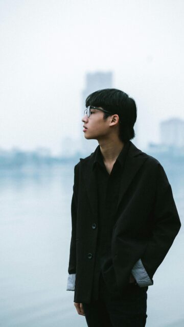 Stylish Young Man in Black Blazer Professional Fashion Portrait Wallpaper