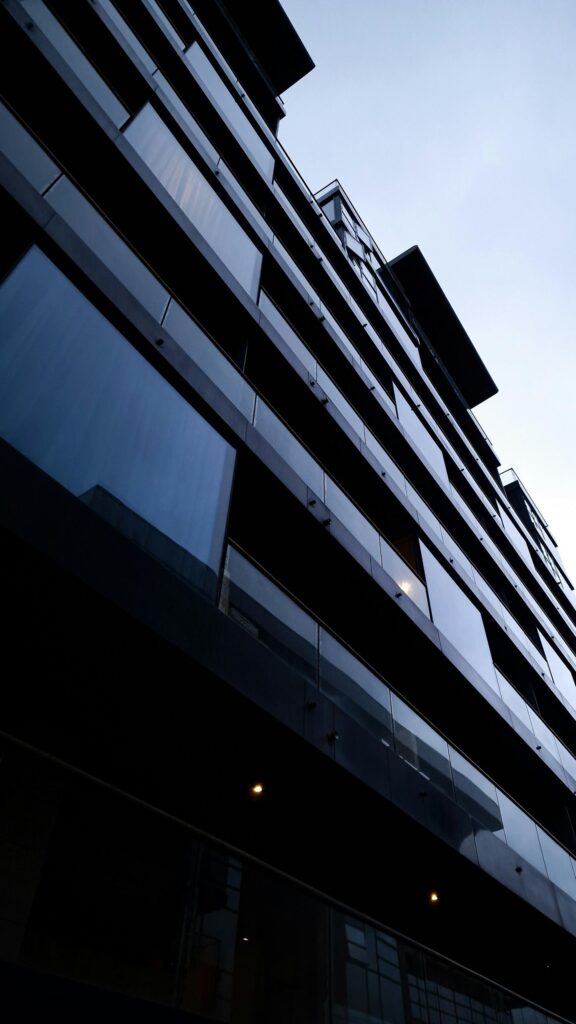 Modern Architectural Skyscraper Low Angle Glass Facade Wallpaper