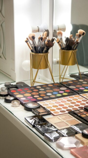 Professional Makeup Vanity Desk with Cosmetic Palettes Mobile Wallpaper