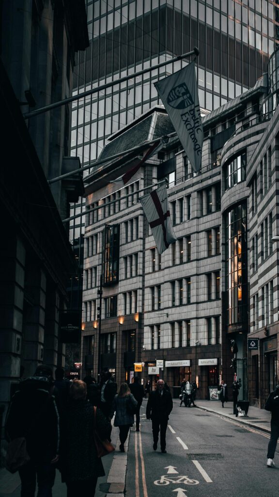 Moody London City Streetscape with Iconic Flags Phone Wallpaper