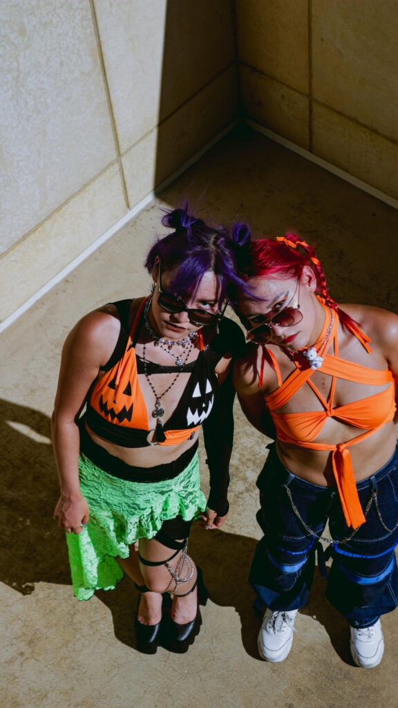 Edgy Alternative Fashion Duo with Vibrant Hair Aesthetic Wallpaper