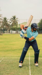 Professional Cricket Batsman in Action Sports Mobile Wallpaper
