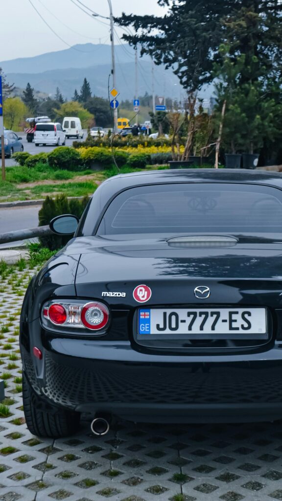 Black Mazda MX-5 Miata Sports Car Rear View Mobile Wallpaper