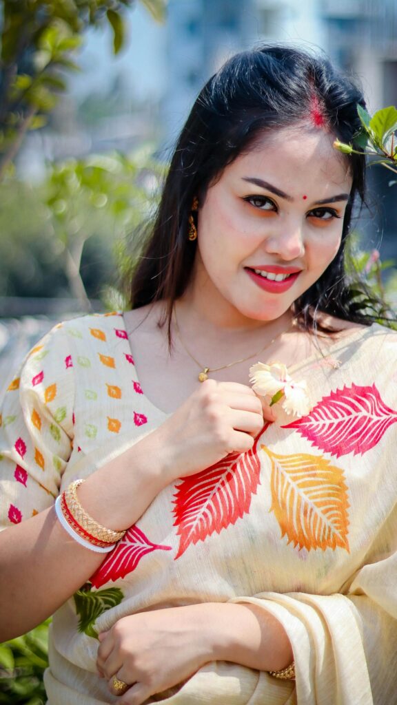 Stunning Portrait of a Beautiful Indian Girl in Traditional Saree Wallpaper