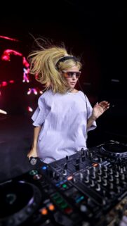 DJ Girl Performing with Blonde Ponytail Live Music Mobile Wallpaper