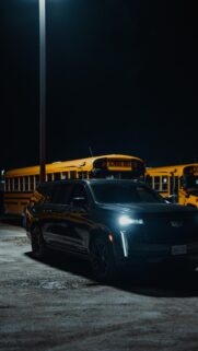 Black Cadillac Escalade Luxury SUV at Night Phone Wallpaper