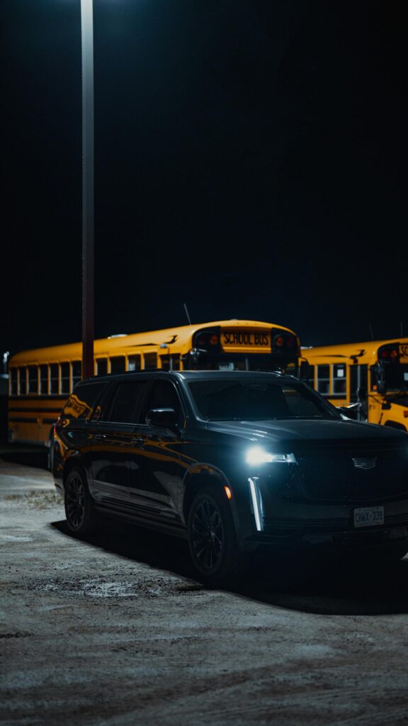 Black Cadillac Escalade Luxury SUV at Night Phone Wallpaper