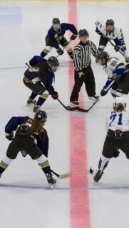 Intense Women Ice Hockey Face-Off Action Sports Mobile Wallpaper