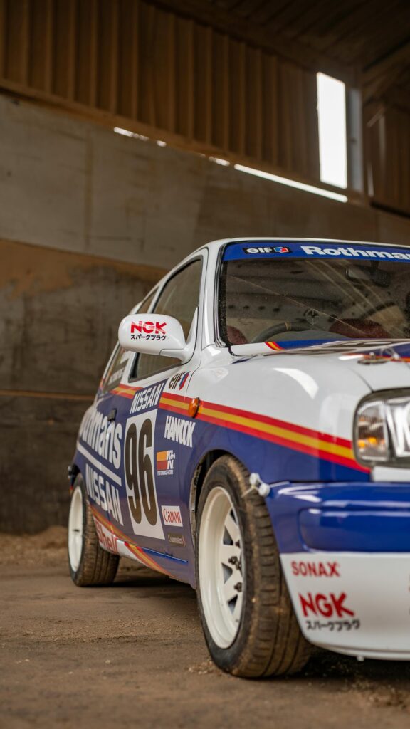 Nissan Micra Rally Car Livery Garage Portrait Mobile Wallpaper