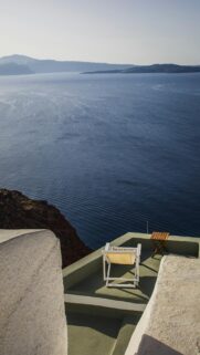 Serene Santorini Cliffside Terrace View Mobile Wallpaper