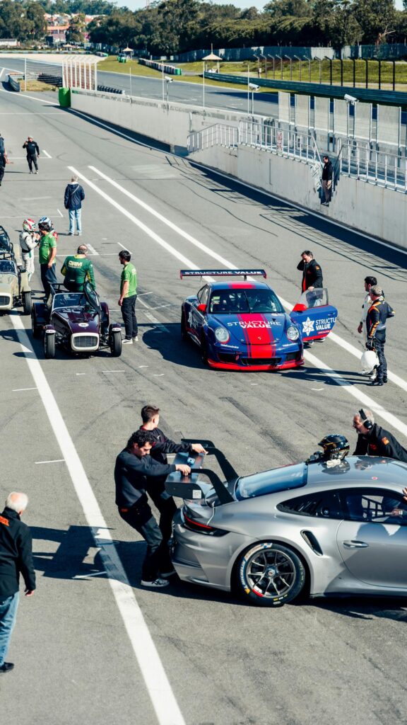 High-Octane Porsche Racing Pit Stop Mobile Phone Wallpaper