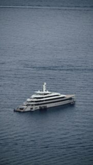Stunning Luxury Superyacht Sailing on Deep Blue Sea Mobile Wallpaper