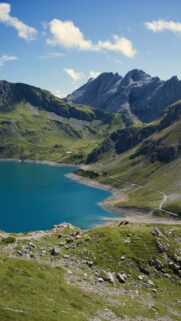 Breathtaking Alpine Lake and Dramatic Mountain Range Phone Wallpaper