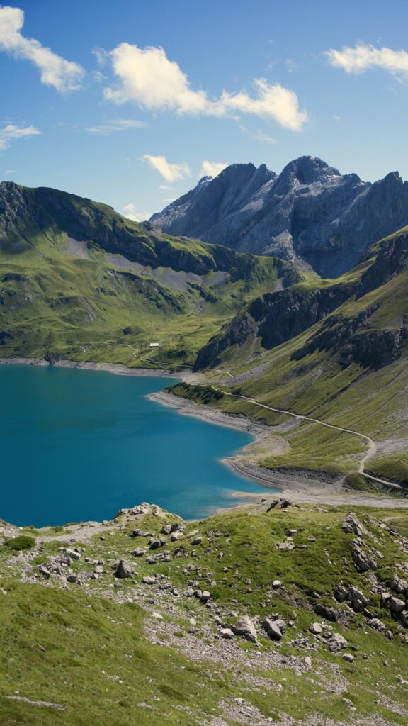 Breathtaking Alpine Lake and Dramatic Mountain Range Phone Wallpaper