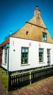 Charming Dutch Cottage with Vintage Architecture Phone Wallpaper