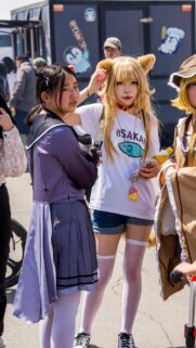 Stunning Cosplay Friends at Anime Convention Mobile Wallpaper