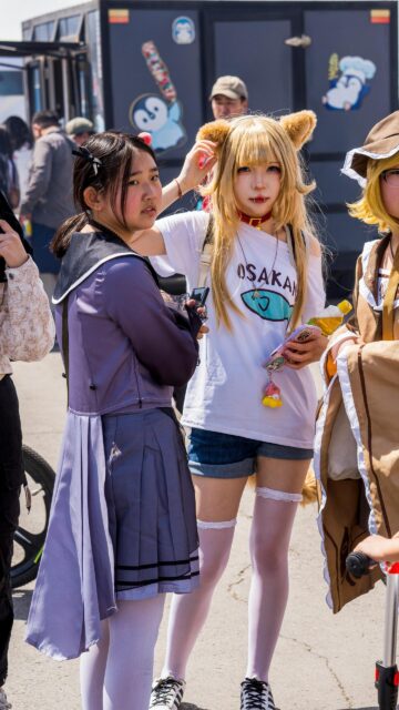 Stunning Cosplay Friends at Anime Convention Mobile Wallpaper