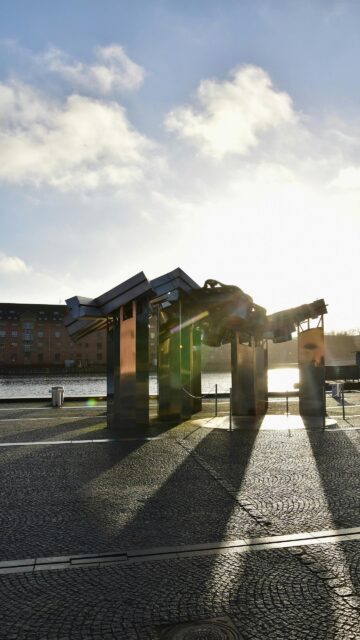 Stunning Steel Urban Sculpture at Golden Hour Mobile Wallpaper