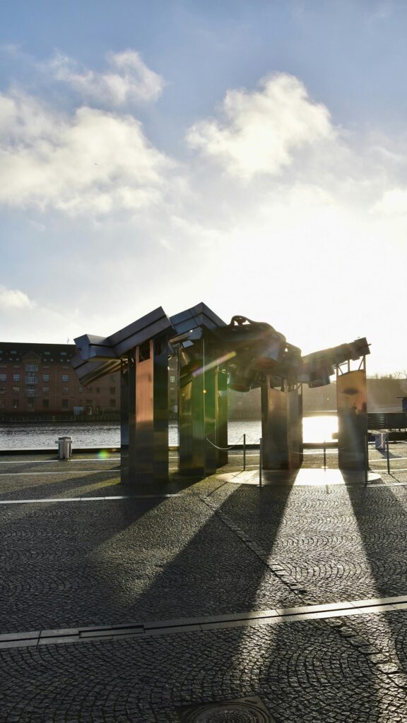 Stunning Steel Urban Sculpture at Golden Hour Mobile Wallpaper