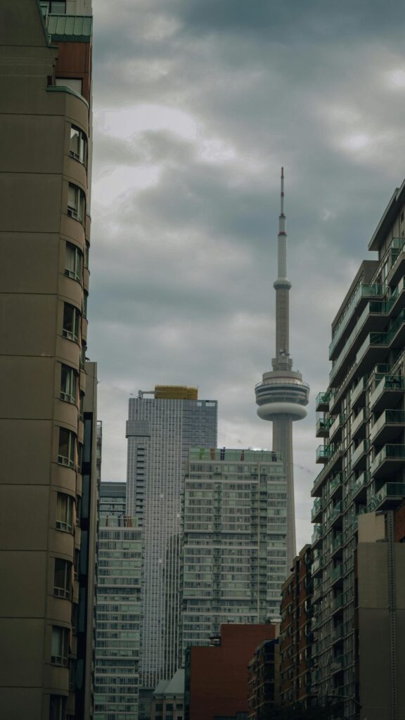 Toronto CN Tower Skyline Under Cloudy Skies Phone Wallpaper