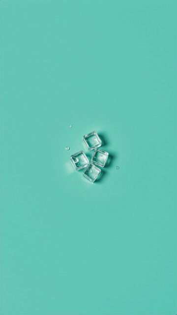 Minimalist Ice Cubes on Vibrant Mint Green Background Wallpaper