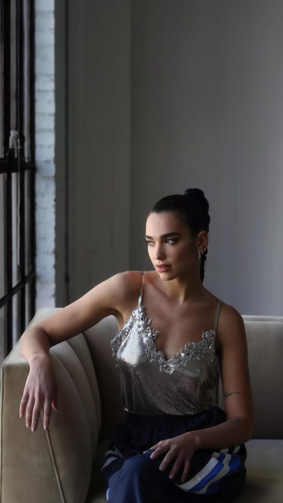 Stunning Dua Lipa Portrait in Shimmering Silver Top Mobile Wallpaper
