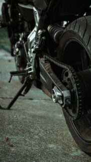 Motorcycle Rear Wheel and Chain Close Up Phone Wallpaper