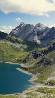 Breathtaking Alpine Lake and Rugged Mountain Peaks Mobile Wallpaper