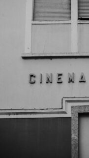 Vintage Cinema Building Exterior Black and White Mobile Wallpaper