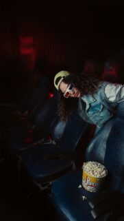 Cool Girl Wearing 3D Glasses in Cinema Movie Theater Wallpaper